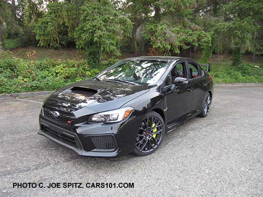 2018 Subaru WRX STI Limited with tall wing spoiler, crystal black silica shown