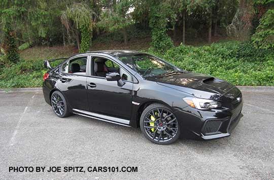 2018 Subaru WRX STI Limited with tall wing spoiler, crystal black silica shown