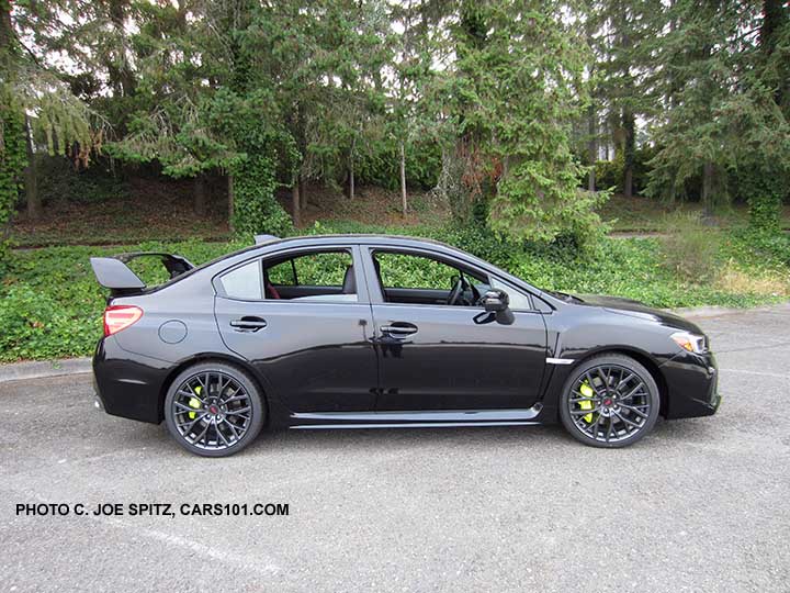 2018 Subaru WRX STI Limited with tall wing spoiler, crystal black silica shown