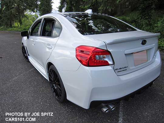 2018 Subaru WRX Premium with optional Vortex generator on the rear roof, and the optional WRX Sport Package with black STI 18" alloy wheels, short shifter, STI exhaust.  Crystal white color