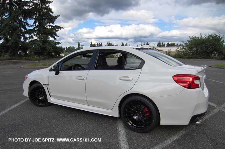 2018 Subaru WRX Premium with optional Vortex generator on the rear roof, and the optional WRX Sport Package with black STI 18" alloy wheels, short shifter, STI exhaust.  Crystal white color