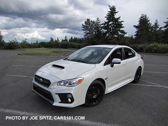 2018 Subaru WRX Premium with optional WRX Sport Package with black STI 18" alloy wheels, short shifter, STI exhaust.  Crystal white color