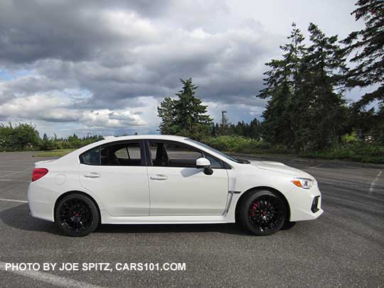 2018 Subaru WRX Premium with optional Vortex generator on the rear roof, and the optional WRX Sport Package with black STI 18" alloy wheels, short shifter, STI exhaust.  Crystal white color