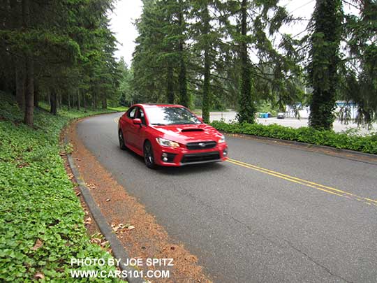 on the road 2018 Subaru WRX Premium, Pure Red color shown