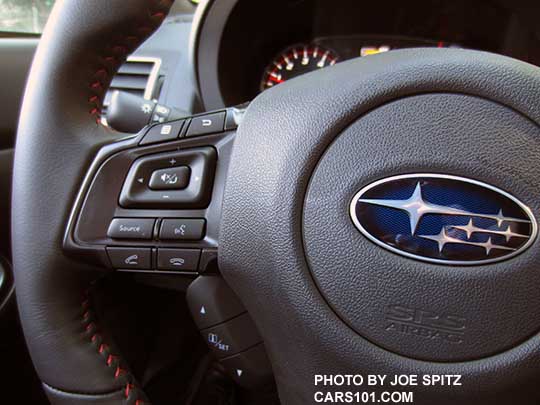 closeup of the 2018 Subaru WRX Limited smooth leather wrapped steering wheel audio and bluetooth controls