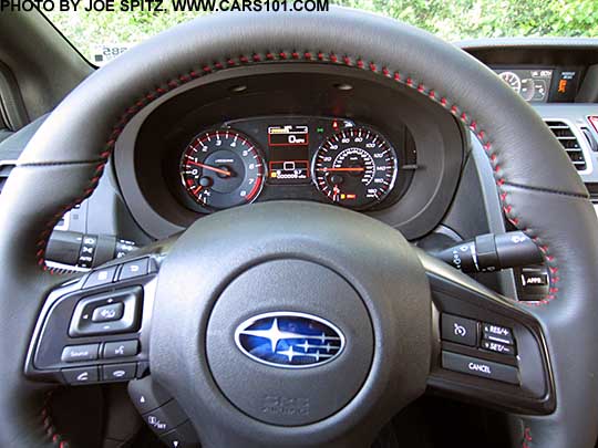 closeup of the 2018 Subaru WRX Limited leather wrapped  steering wheel, and dash instrument panel gauges.