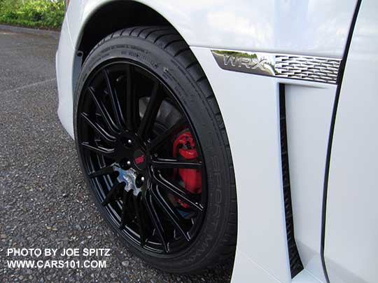 2018 Subaru WRX optional Sport Package black STI alloy wheel. Premium and Limited 18" wheel shown. Dealer installed only.  This is Premium with the optional Performance Pkg with red brake calipers. Wheel is dealer installed only.