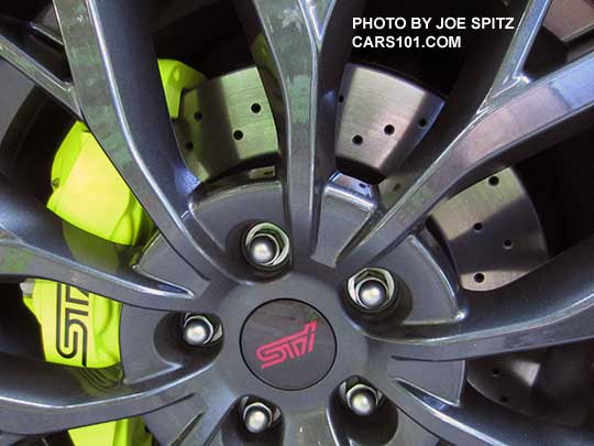 closeup of the 2018 Subaru WRX STI and  STI Limited 19" alloy wheel, drilled rotors, yellow brake caliper