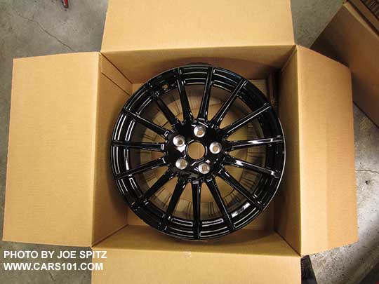 2018 Subaru WRX Premium and Limited optional black 18" STI alloy wheel shown in the shipping box. Dealer installed only.