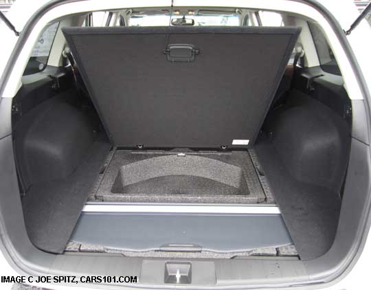 subaru outback cargo luagge area coiver shown stowed under the cargo subfloor. 2013 outback shown